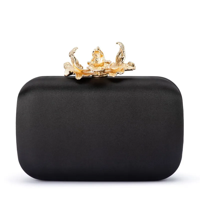ADELE Orchid Lock Clutch sold by Olga Berg