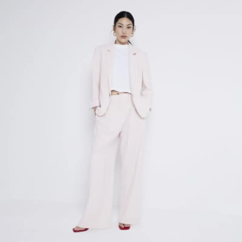 Pink wide leg trousers sold by River Island