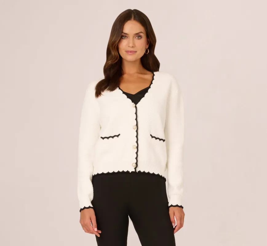 Cardigan Sweater With Contrast Scallop Trim In Ivory Black sold by Adrianna Papell
