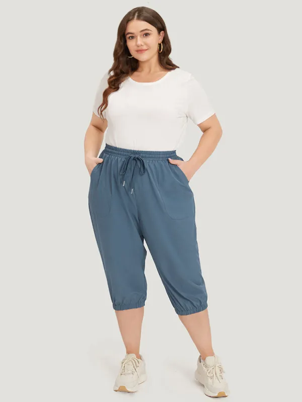 Solid Elastic Waist Drawstring Slant Pocket Cropped Pants sold by Bloomchic