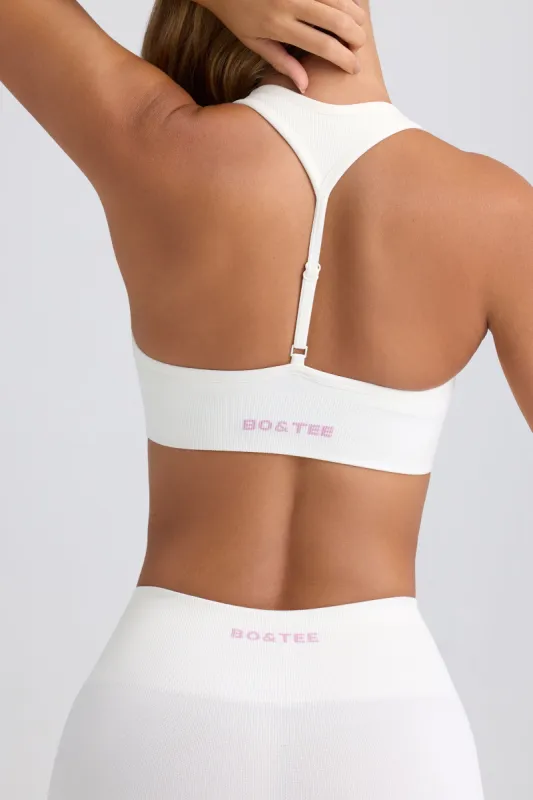 Super Sculpt Seamless T-Back Sports Bra in Eggshell sold by Oh Polly