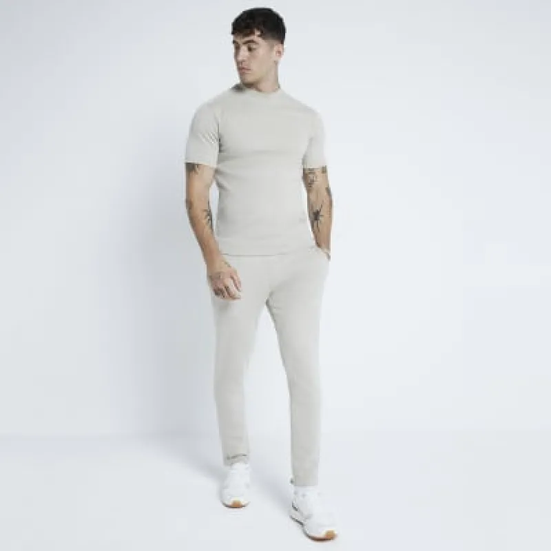 Stone Pique Skinny Fit Joggers sold by River Island