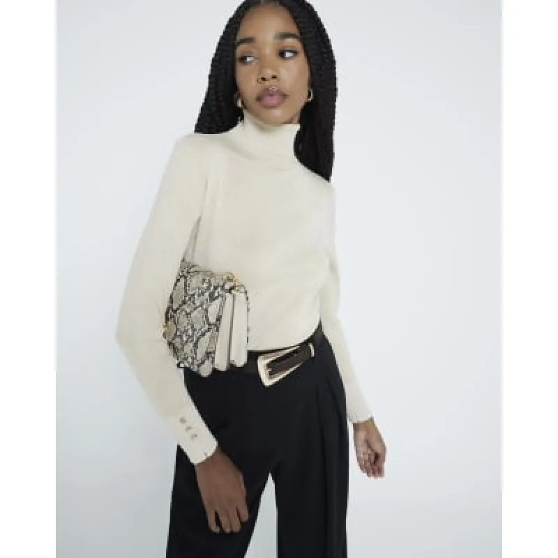 Cream Glitter Roll Neck Top sold by River Island