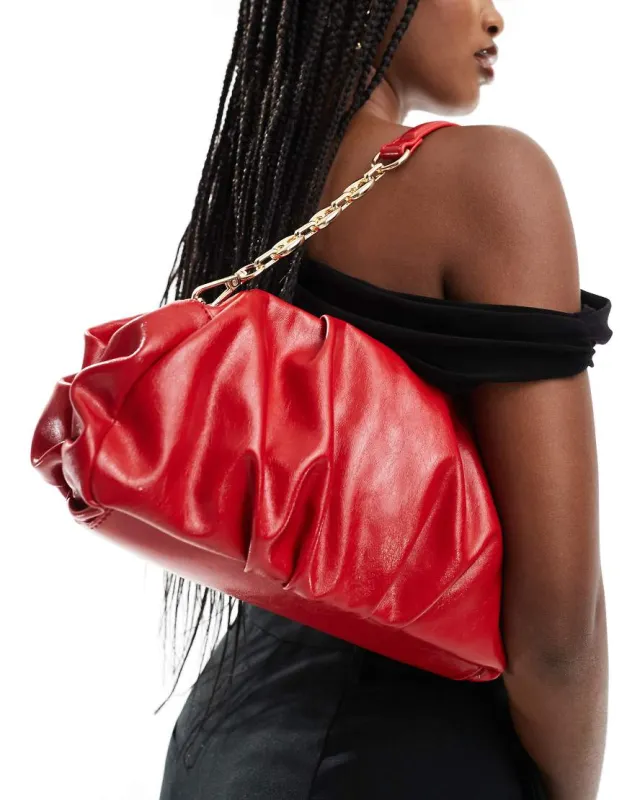 ASOS DESIGN gathered clutch bag with chain strap sold by ASOS