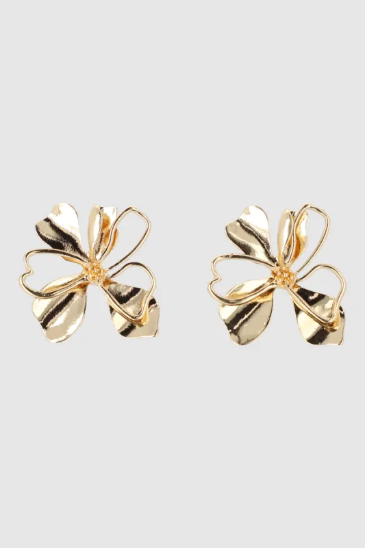 Aretes flor metalica sold by Shasa