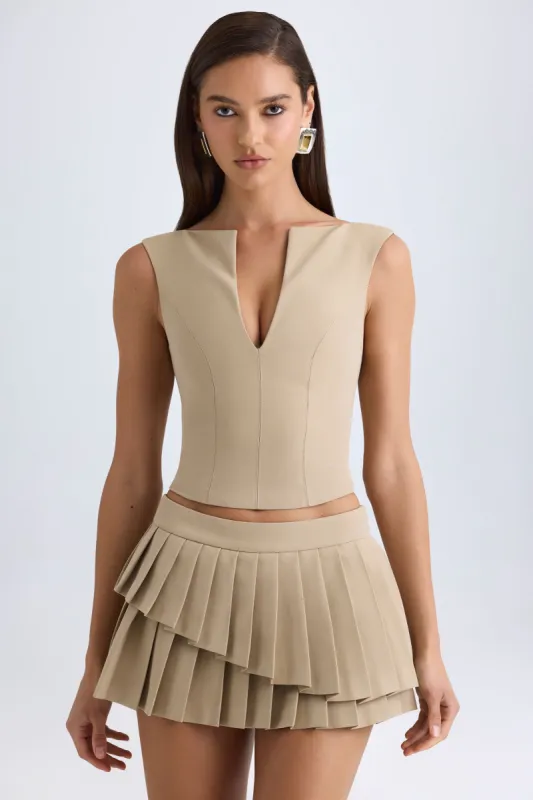 Layered Pleated Low-Rise Mini Skirt in Camel sold by Oh Polly