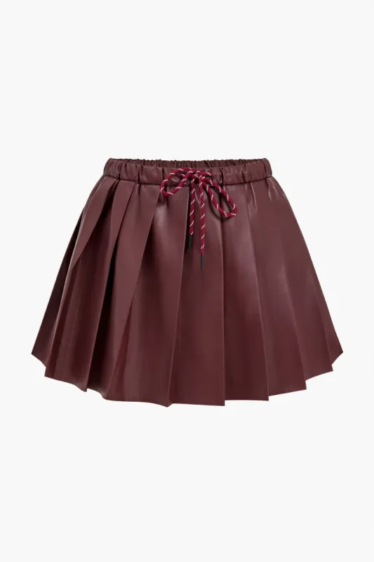 Solid Faux Leather Pleated High Waist Tie-Up Skirt sold by Micas