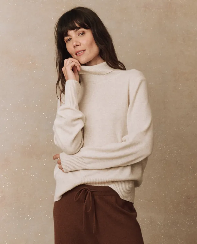 The Cashmere Turtleneck Sweater. -- Ivory sold by THE GREAT.