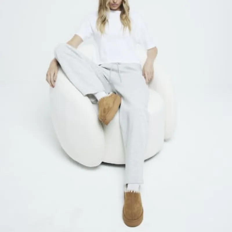 Tan Brown suedette faux fur platform mules sold by River Island