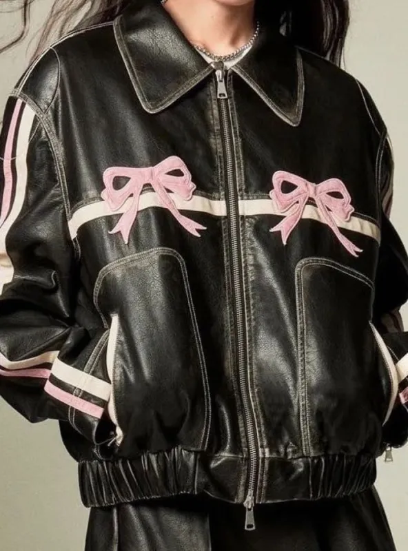 Faux leather bow biker jacket sold by Charming Charlie