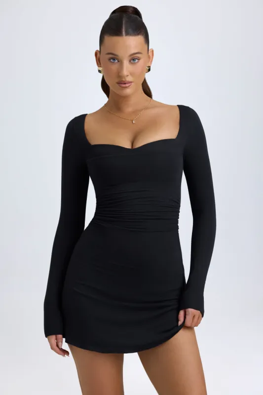 Modal Layered A-Line Mini Dress in Black sold by Oh Polly