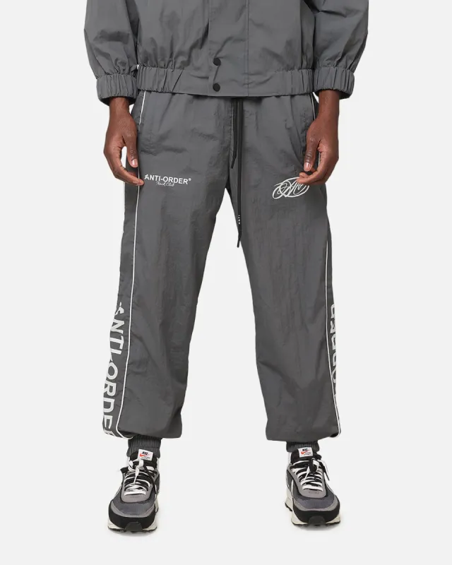 The Anti Order Track Club Nylon Jogger Dark Grey/Grey sold by Culture Kings