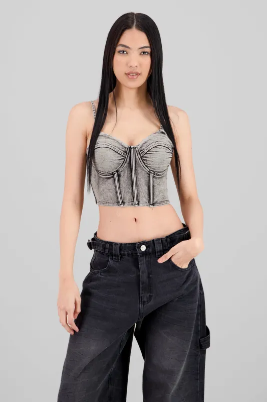 Corset denim con estoperoles sold by Shasa