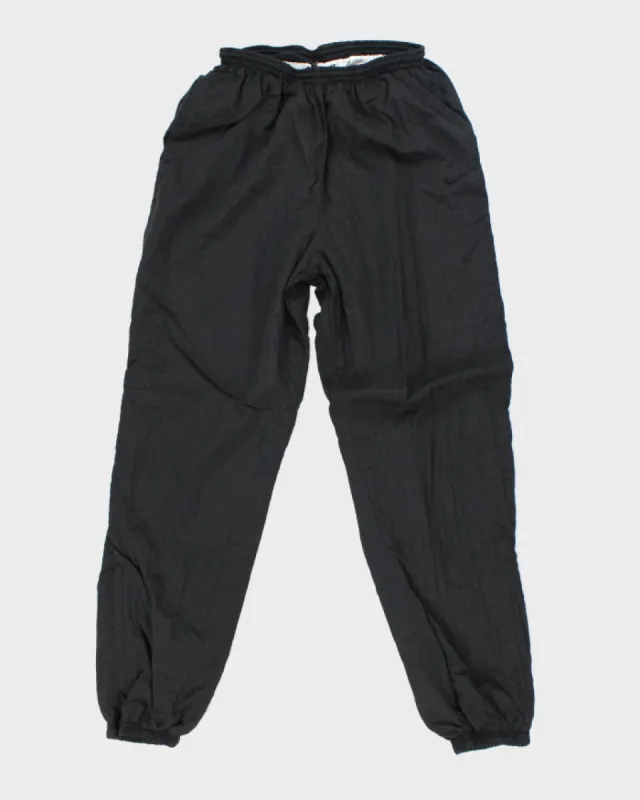 Vintage 90's Nike Blackout Tracksuit Bottoms - M sold by Rokit