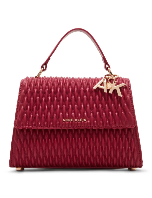 Medium ruched flap top handle with convertible strap sold by Anne Klein