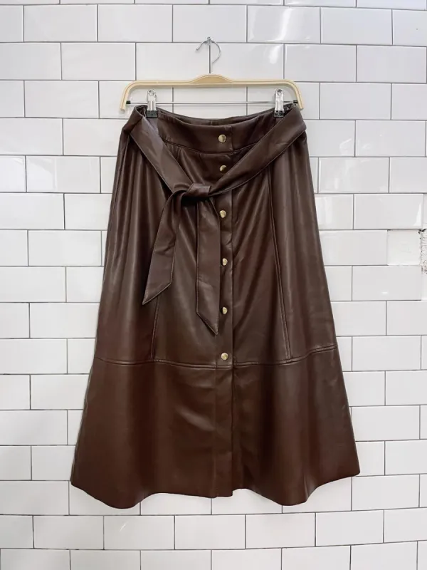 belle vere faux leather snap button midi skirt sold by Good Market Thrift Store