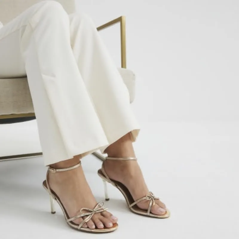 Gold Bow Heeled Sandals sold by River Island