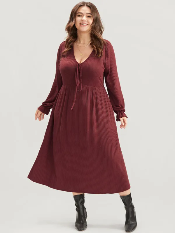 Solid Lantern Sleeve Tie Neck Pocket Rib Knit Dress sold by Bloomchic
