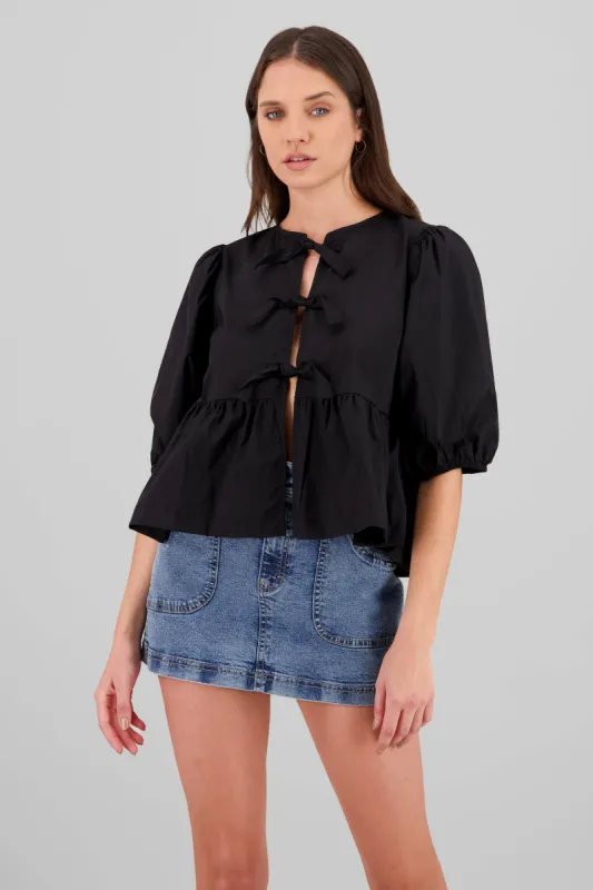 Blusa abullonada con moños lisa sold by Shasa