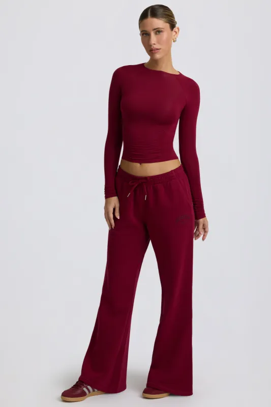 Low-Rise Wide-Leg Joggers in Burgundy sold by Oh Polly