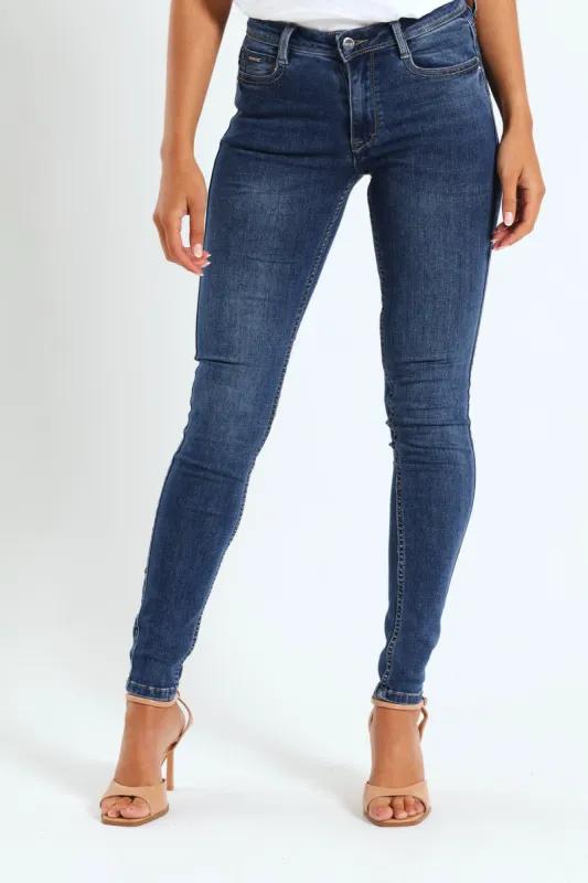 Axel Skinny Jean With Back Pocket Embroidery Detail - Mid Blue sold by Edgars 