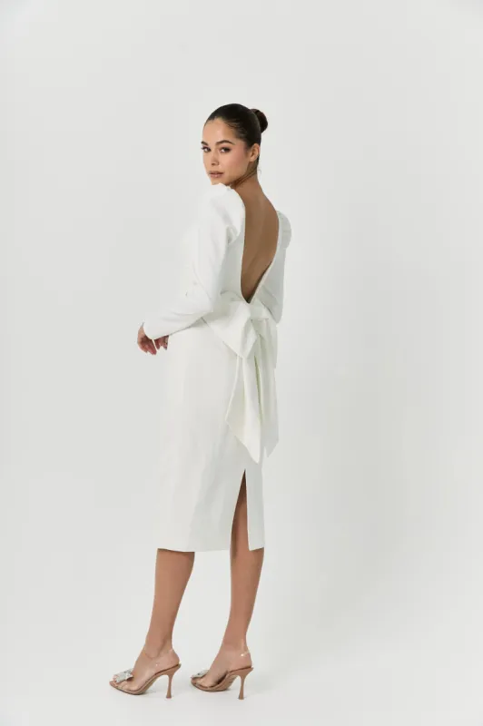 White midi bow dress sold by Anne Louise Boutique