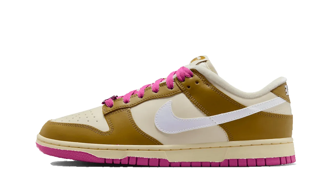 Nike Dunk Low SE Bronzine Pink sold by Addict Sneakers