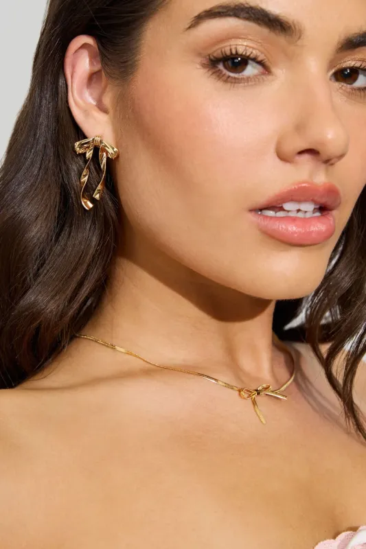 Metal Bow Earrings sold by Garage