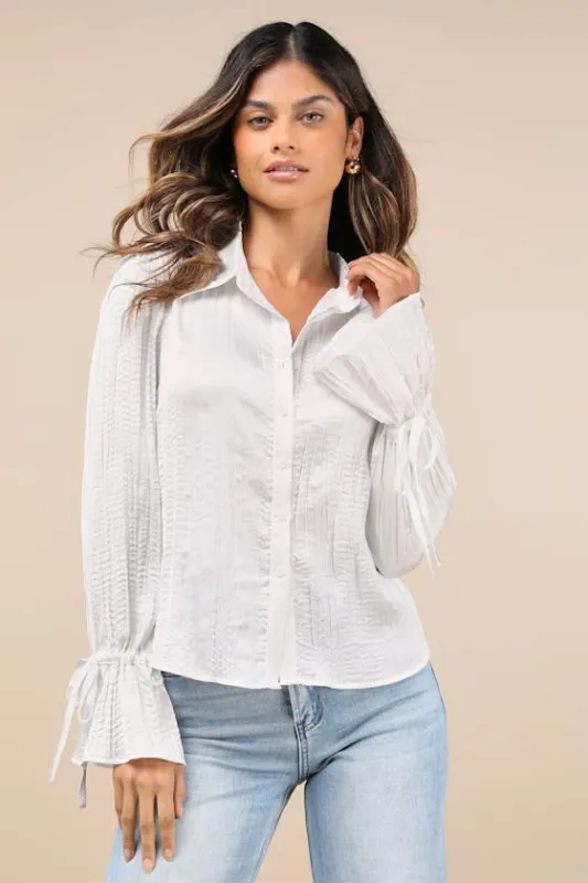 Enhanced Charm Ivory Plisse Crinkled Tie-Cuff Button-Up Top sold by Lulus