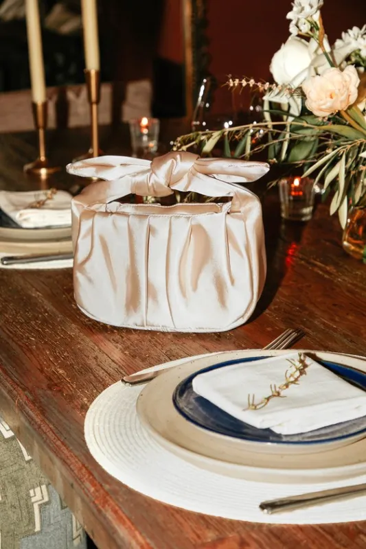 Essential Style Champagne Satin Knot Handle Clutch Bag sold by Lulus
