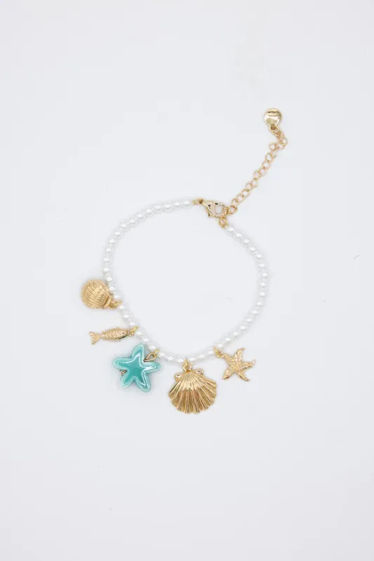 Sea Life Charm Pearl Bracelet in Gold | QBA478-GDBLE sold by Glik’s
