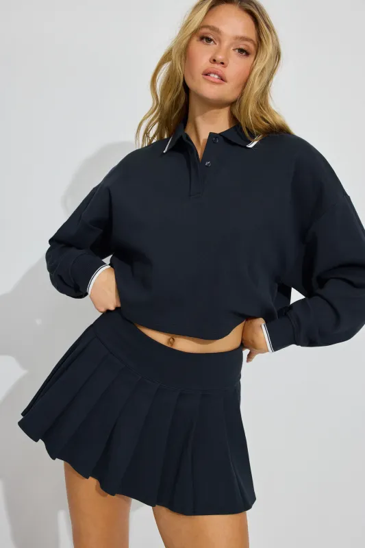 Pique Pleated Active Skort sold by Garage