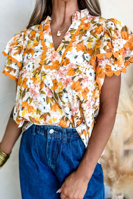 Russet Orange Ruffled V Neck Scalloped Short Sleeve Floral Blouse sold by Beagle Boutique