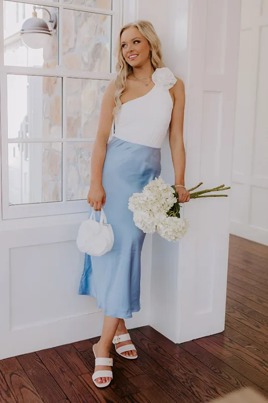 The Adeline High Waist Satin Midi Skirt in Sky Blue sold by Impressions