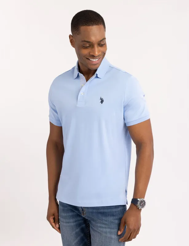SOLID INTERLOCK POLO SHIRT WITH WOVEN TRIM sold by U.S. Polo Assn.