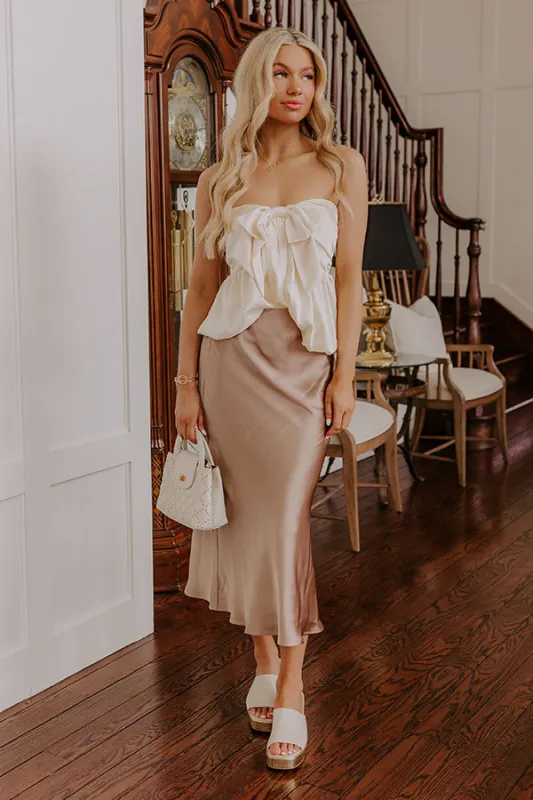 The Adeline High Waist Satin Midi Skirt in Taupe sold by Impressions