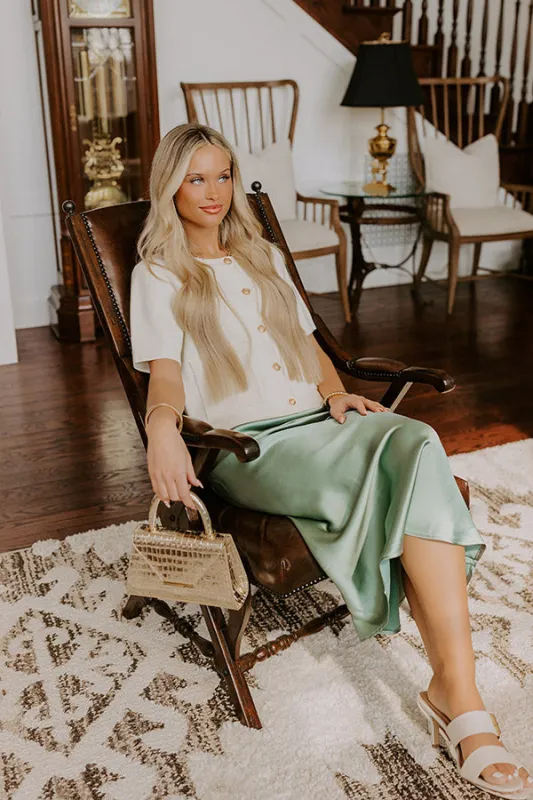 The Adeline High Waist Satin Midi Skirt in Sage sold by Impressions