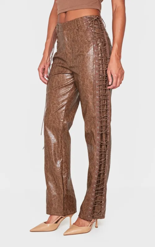 Brown Faux Leather Lace Up Straight Leg Trousers sold by Pretty Little Thing