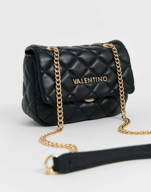 Valentino Ocarina quilted cross body bag with chain strap in black sold by ASOS