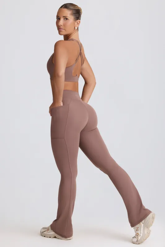 Soft Active Crossover Flared Trousers in Mocha sold by Oh Polly