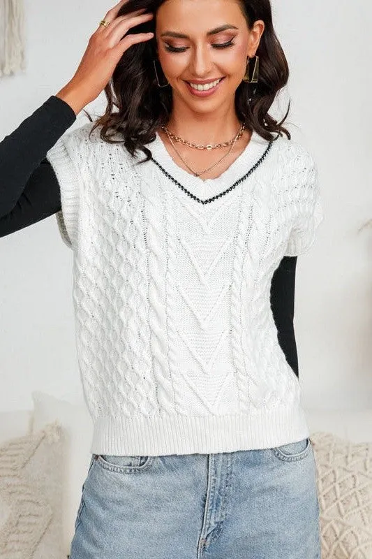 Cropped knit sweater vest sold by Charming Charlie