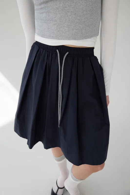 PLEATED DRAWSTRING MIDI SKIRT sold by OAK AND FORT