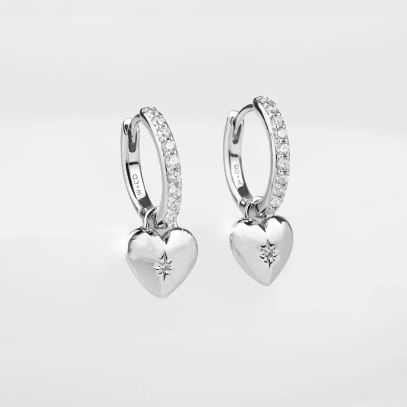 Heart Charm Silver Huggie Earrings sold by Wanderlust and Co