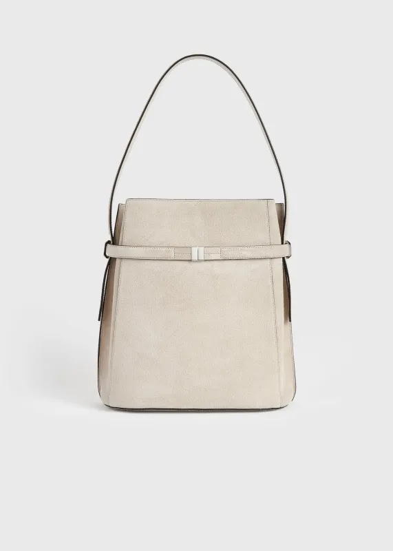 Belted suede bucket bag pearl sold by Toteme