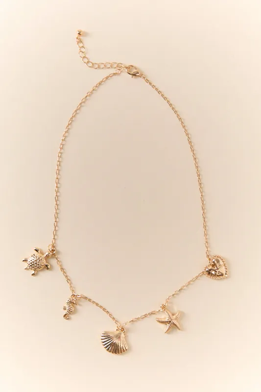 Under The Sea Gold Charm Necklace sold by Pink Lily