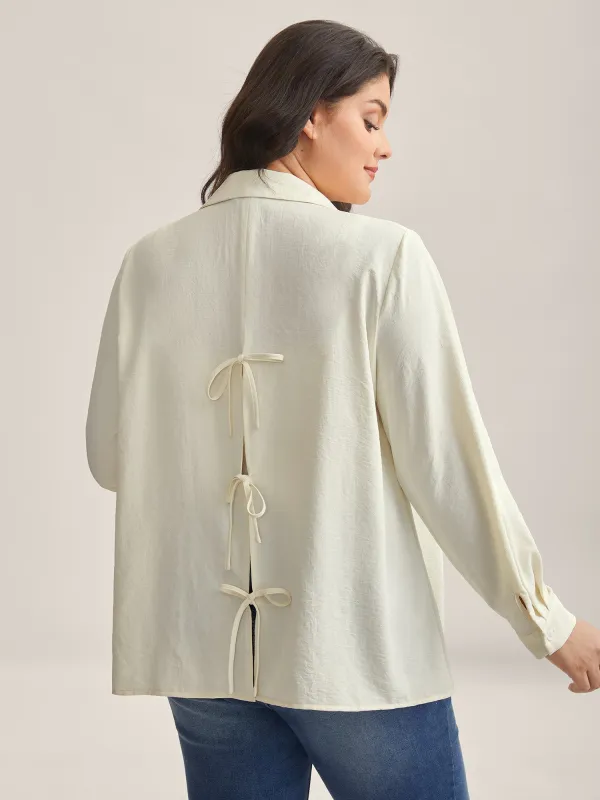 Bow Back Button Placket Solid Blouse sold by Bloomchic