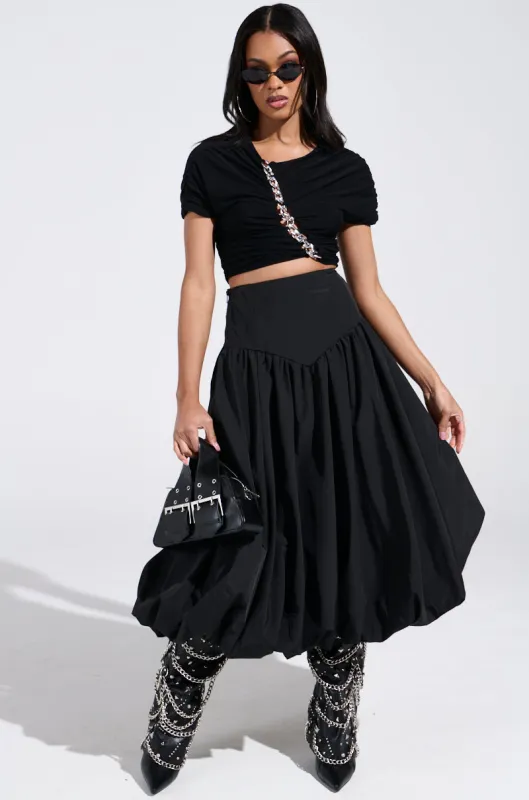 I FOUND YOU DROP WAIST MIDI SKIRT IN BLACK sold by AKIRA