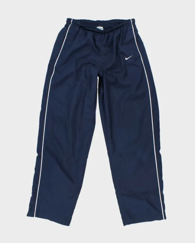 Vintage 2000's Nike Lightweight Small Swoosh Tracksuit Bottoms - W28 L31 sold by Rokit