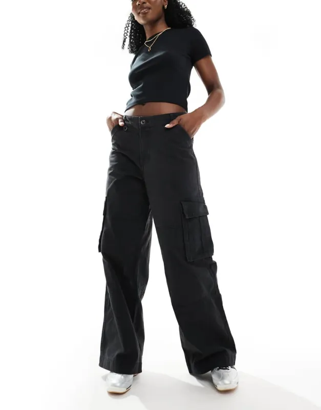Cotton:On Benny cargo pant in black sold by ASOS