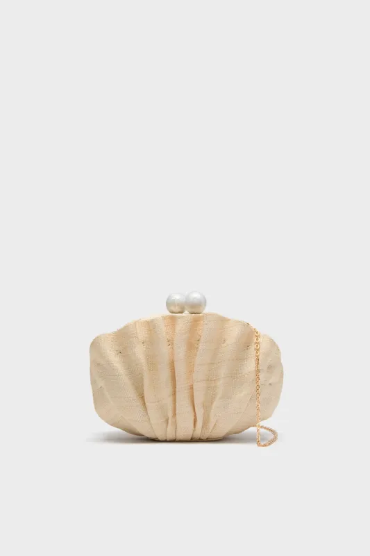 Sand The Origami Shell Clutch sold by Tuckernuck